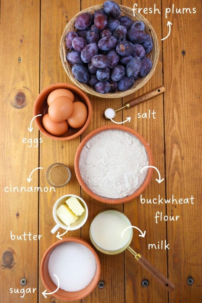 Gathering ingredients for gluten free buckwheat clafoutis: plums, buckwheat flour, eggs, butter, sugar, cinnamon and salt